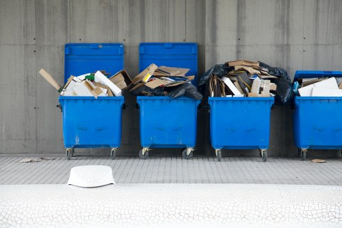 Construction site in Camden Town with builders managing waste clearance